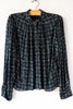Esperanzo Checks Top