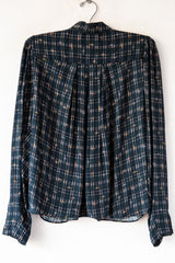 Esperanzo Checks Top