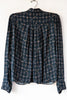 Esperanzo Checks Top